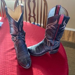 Tony Lama black with red. Nice heel been worn but a lot left in these boots.